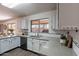 Modern kitchen features quartz counters, white cabinets, stainless steel appliances, and subway tile backsplash at 9325 E Fairfield St, Mesa, AZ 85207