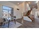 Welcoming living room with high ceilings, a staircase, hardwood floors, and large windows at 9325 E Fairfield St, Mesa, AZ 85207