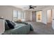 This main bedroom is spacious, has great light, and features a barn door to the ensuite bathroom at 9325 E Fairfield St, Mesa, AZ 85207