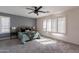 Stylish main bedroom featuring a decorative accent wall, plantation shutters, and lots of space at 9325 E Fairfield St, Mesa, AZ 85207