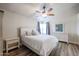 Bright bedroom with ceiling fan and white furniture at 1025 E Kerry Ln, Phoenix, AZ 85024