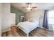 Well-lit bedroom featuring a ceiling fan and wood-look floors at 1025 E Kerry Ln, Phoenix, AZ 85024