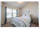 Bedroom with window seating and floral bedding at 1025 E Kerry Ln, Phoenix, AZ 85024