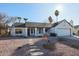 White single story home with a two car garage and nicely landscaped front yard at 1025 E Kerry Ln, Phoenix, AZ 85024