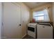 Laundry room with washer, dryer, and storage at 1025 E Kerry Ln, Phoenix, AZ 85024