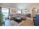 Spacious living room with L-shaped sofa and large windows at 1025 E Kerry Ln, Phoenix, AZ 85024