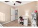 bedroom with desk, shelving, and closet at 10506 W Pasadena Ave, Glendale, AZ 85307