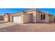 Front view of a house with a two-car garage at 10506 W Pasadena Ave, Glendale, AZ 85307