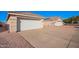 Single car garage with gravel driveway at 10506 W Pasadena Ave, Glendale, AZ 85307