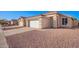 One-story house with a white garage door and desert landscaping at 10506 W Pasadena Ave, Glendale, AZ 85307