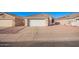 Front view of a single story home with a white garage door at 10506 W Pasadena Ave, Glendale, AZ 85307