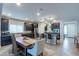 Open concept kitchen with island and dining area at 10834 W Swayback Pass, Peoria, AZ 85383