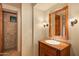 Bathroom with single vanity and view of shower at 10962 E Old Trails Rd, Scottsdale, AZ 85262