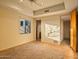 Bedroom with window, ceiling fan, and adjacent bathroom at 10962 E Old Trails Rd, Scottsdale, AZ 85262