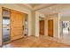 Bright and spacious entryway with wood floors and doors at 10962 E Old Trails Rd, Scottsdale, AZ 85262