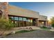 Stunning home exterior with stone and glass details at 10962 E Old Trails Rd, Scottsdale, AZ 85262