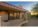 Modern home exterior with stone accents and large windows at 10962 E Old Trails Rd, Scottsdale, AZ 85262