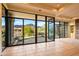 Living room with expansive windows and mountain views at 10962 E Old Trails Rd, Scottsdale, AZ 85262