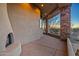 Covered patio with fireplace and mountain views at 10962 E Old Trails Rd, Scottsdale, AZ 85262