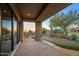 Covered patio with stone pillars and sunset views at 10962 E Old Trails Rd, Scottsdale, AZ 85262