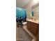 Bathroom with shower/tub combo, wood vanity, and ocean-themed decor at 11596 W Sierra Dawn Blvd # 105, Surprise, AZ 85378