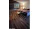 Bedroom featuring wood-look flooring and a mural at 11596 W Sierra Dawn Blvd # 105, Surprise, AZ 85378