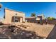 Large backyard with raised garden beds and patio at 13185 W Calavar Rd, Surprise, AZ 85379