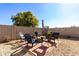 Cozy patio with fire pit and seating for relaxation at 13185 W Calavar Rd, Surprise, AZ 85379