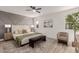 Spacious main bedroom with wood flooring and accent wall at 13223 W Gaucho Dr, Sun City West, AZ 85375