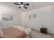 Serene bedroom with light walls and stylish decor at 13223 W Gaucho Dr, Sun City West, AZ 85375