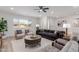 Living room with comfy seating and a large window at 13223 W Gaucho Dr, Sun City West, AZ 85375