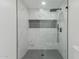 Large walk-in shower with marble tile and glass enclosure at 13223 W Gaucho Dr, Sun City West, AZ 85375