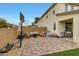 Well-designed backyard with a paved patio, a basketball court, and an outdoor seating area at 13235 W Tether Trl, Peoria, AZ 85383