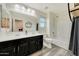 Modern bathroom featuring a double sink vanity, shower-tub combination and neutral wall color at 13235 W Tether Trl, Peoria, AZ 85383