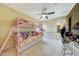 Bright bedroom featuring light-colored walls, overhead fan, and a cozy bunk bed at 13235 W Tether Trl, Peoria, AZ 85383