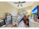 Cozy bedroom with a crib, dresser, and window, creating a warm atmosphere at 13235 W Tether Trl, Peoria, AZ 85383