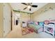 Bright bedroom featuring stylish decor, light-colored walls, and an adjacent doorway at 13235 W Tether Trl, Peoria, AZ 85383