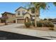 Charming two-story home with a well-manicured front yard and a two-car garage at 13235 W Tether Trl, Peoria, AZ 85383