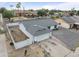 An aerial view of a single-story home with a two-car garage and desert landscaping at 13804 N 52Nd Dr, Glendale, AZ 85306