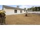 View of the white brick home and the spacious backyard, great for entertaining at 13804 N 52Nd Dr, Glendale, AZ 85306