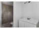 Bathroom vanity and stall shower with tiled walls and niche at 13804 N 52Nd Dr, Glendale, AZ 85306
