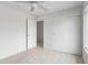 Bright bedroom featuring neutral paint, tile floors, and a closet with sliding doors at 13804 N 52Nd Dr, Glendale, AZ 85306