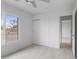 Bedroom features neutral paint and trim, tile floors and a window with a view at 13804 N 52Nd Dr, Glendale, AZ 85306
