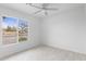 Bright bedroom with large window, neutral walls, and tile floors at 13804 N 52Nd Dr, Glendale, AZ 85306