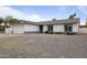Well-maintained single-story home with a two-car garage and a gravel front yard at 13804 N 52Nd Dr, Glendale, AZ 85306