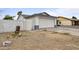 Side view of a single story home showing the garage, side yard, and fence at 13804 N 52Nd Dr, Glendale, AZ 85306