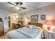 Bedroom with a double bed, ceiling fan and ensuite bathroom at 14300 W Bell Rd # 502, Surprise, AZ 85374