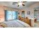 Bedroom with a dresser, ceiling fan and window at 14300 W Bell Rd # 502, Surprise, AZ 85374