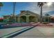 Community center with golf cart and palm trees at 14300 W Bell Rd # 502, Surprise, AZ 85374