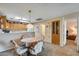 Bright dining area with table and chairs near kitchen and living room at 14300 W Bell Rd # 502, Surprise, AZ 85374